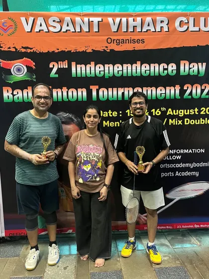 A group of winners from the Independence Day tournament posing with their trophies.