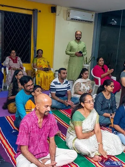 A serene moment from our Bhakti Immersion Kirtan event. Participants are seated and listening intently, creating a peaceful and devotional atmosphere in our studio.