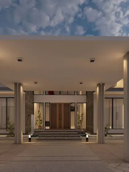 The grand portico entrance of 'Zen Oasis' in Coimbatore. Supported by modern pillars, it creates a powerful first impression while providing a sheltered drop-off that is both functional and architecturally striking.