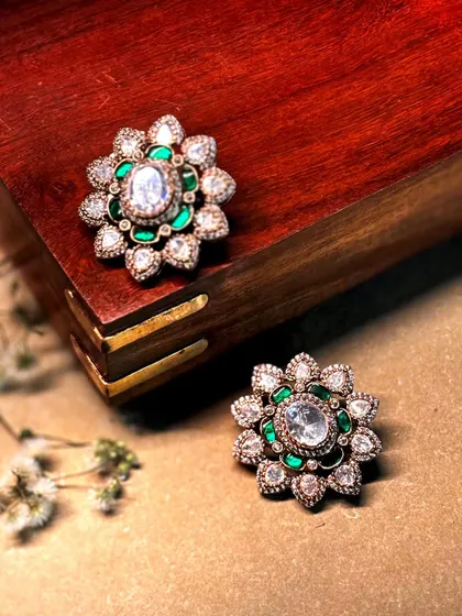 A variation of our floral studs, this pair features a green enamel base that makes the polki diamonds pop.