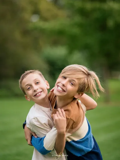 The biggest, happiest smiles! The bond between these two brothers is so evident in this joyful, candid hug. Capturing the energy of kids being kids is what it's all about.
