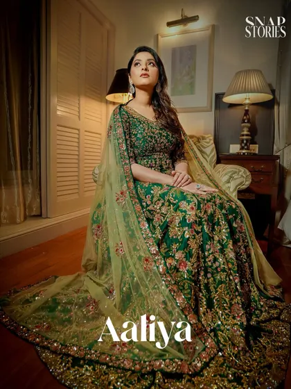 An artistic and dramatic portrait of the bride in her magnificent green gown. We use light and shadow to create moody and captivating bridal photos.