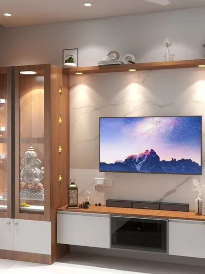 A close-up of a TV unit in Channasandra that seamlessly incorporates a lighted puja mandir, demonstrating how to blend sacred spaces into modern living areas.