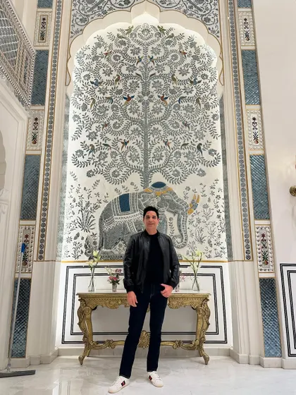 Standing before a beautiful piece of traditional Rajasthani art in Jaipur. The city's rich culture and artistic heritage are a constant source of inspiration.