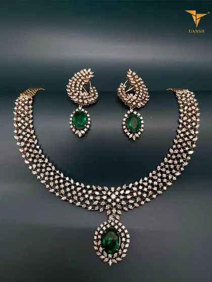 Wearing this exquisite Diamond and Emerald Set is like wrapping yourself in love and heritage. Shine bright at every celebration and let your story unfold with a piece that is both classic and contemporary.