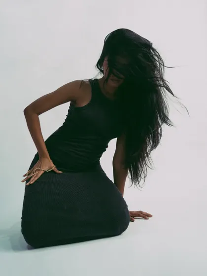 Capturing the peak of a hair flip, this shot is all about high energy and drama.