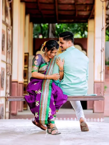 Laughter and love on a traditional swing. This image beautifully captures a candid, unposed moment that feels authentic and full of happiness.