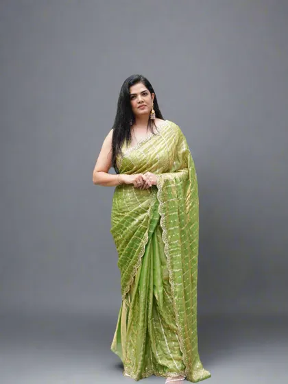 A full-length pose in the lime green organza tissue saree, perfect for any celebration where you want to look effortlessly chic.