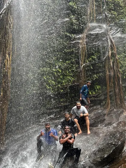 Friends enjoying a natural slide on the rocks at Hidlumane Falls. We always find ways to have fun.