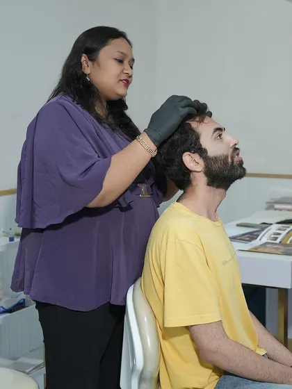 Here, one of my trained dermatologists is performing a targeted hair restoration treatment. Every procedure, whether it's GFC or QR678, begins with a thorough scalp analysis to ensure the treatment plan is perfectly suited to your specific hair loss concerns.