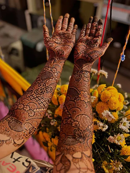 A lovely design with peacock motifs and the initials 'ZH' for the bride.