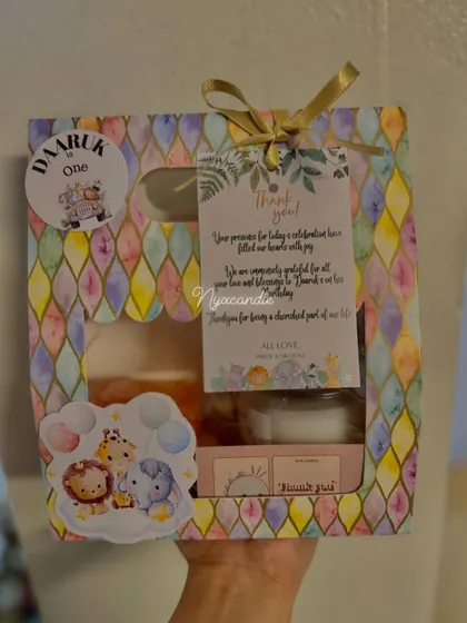 This safari-themed hamper was created for a first birthday. The box is filled with a scented candle, themed soap, and chocolates, all tied together with a personalized thank you tag.