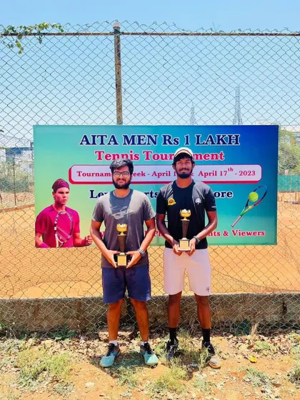 Our player Oges with his partner after winning the men's doubles title in Coimbatore.