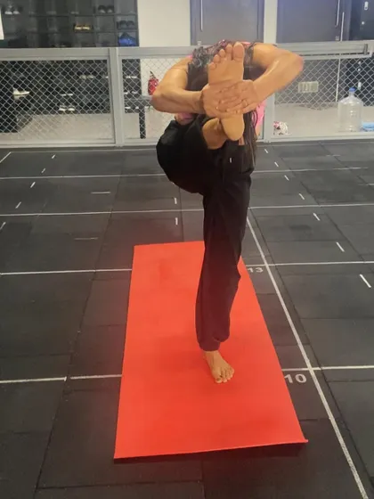 A repeat of the standing balancing pose, showing the stability and concentration needed.