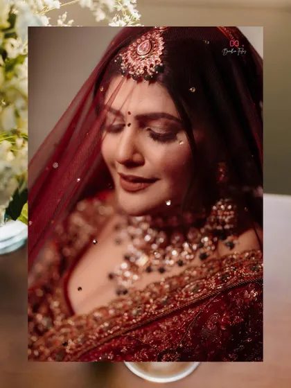 A soft and dreamy close-up of the bride, with her veil creating a beautiful, ethereal frame around her face.