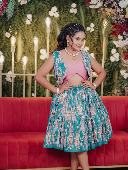 My fun and quirky mehendi outfit, a printed green skirt with a pink crop top and an embroidered jacket.