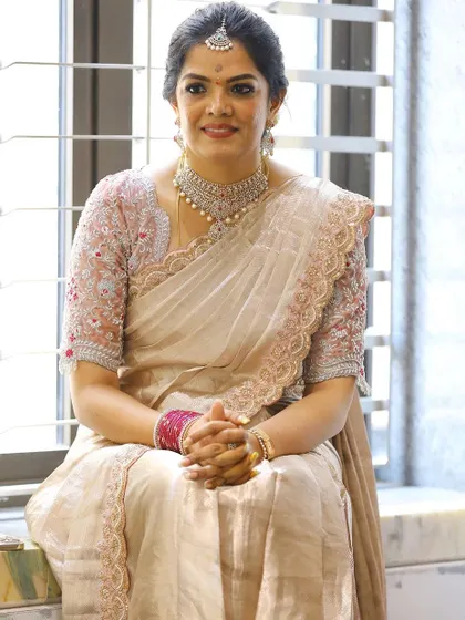 Photos from my housewarming, wearing a saree and blouse I designed myself. I took a plain tissue saree and completely transformed it with a hand-worked scalloped border and a custom-stitched velvet blouse. It’s a look that’s very close to my heart.