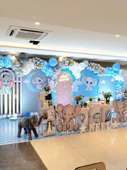 A cute baby elephant theme for a first birthday, with a blue and white color scheme.