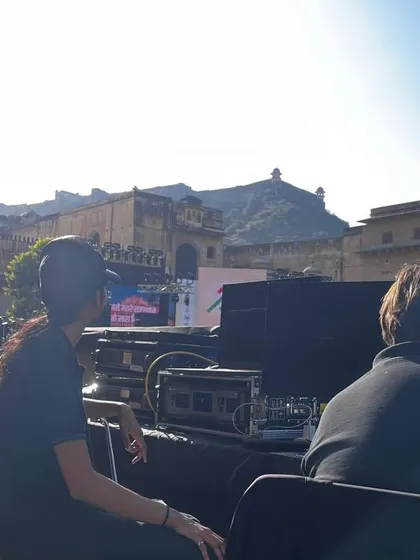 Our team at the outdoor console for the Khelo India launch, with the historic venue in the background. We are equipped to manage events in any setting.