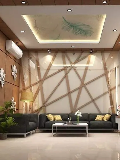 This living room features interesting wall textures and a unique false ceiling design. The dark sofa and abstract wall art add a touch of modern sophistication.