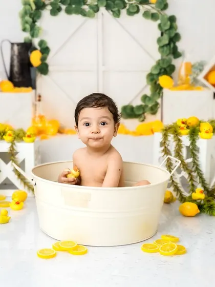 Making a funny face for the camera! I love capturing all the silly, candid moments during these one-year-old milestone sessions.