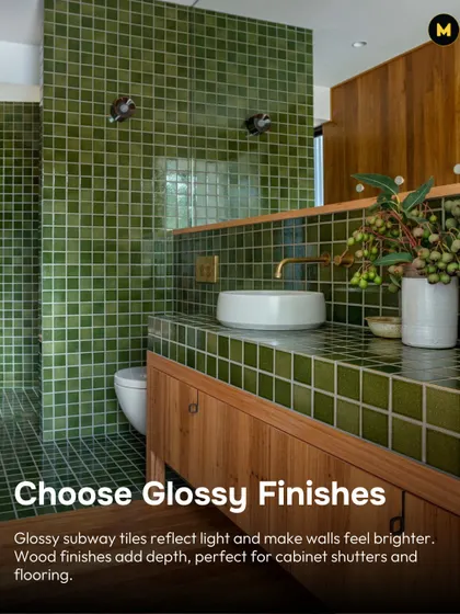 In a small bathroom, choose glossy finishes. Glossy subway tiles reflect light and make walls feel brighter. Pairing them with wood finishes on the cabinets adds warmth and depth.