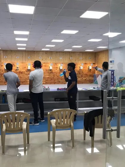 A view of our modern, air-conditioned 10m shooting range during a training session. I ensure a clean, safe, and professional environment for all campers to learn and practice in.