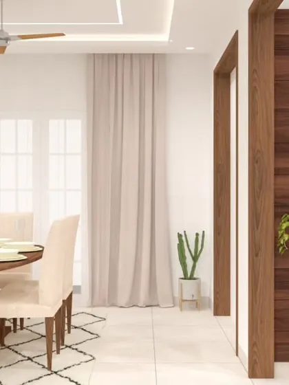 A bright and elegant dining area featuring a wash basin with a backlit mirror and a wood-paneled accent wall. The design separates the dining space from the main living area, creating an intimate setting for meals.