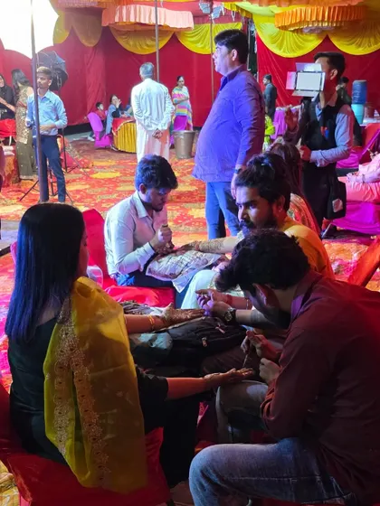 My team is hard at work applying mehandi for guests at a wedding. We ensure that every guest gets a beautiful design to be part of the celebration.