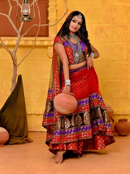 Continuing the Rajasthani narrative, this full-length shot establishes the scene. The earthy set with clay pots and a rustic backdrop transports the viewer, making it a powerful image for a conceptual portfolio.