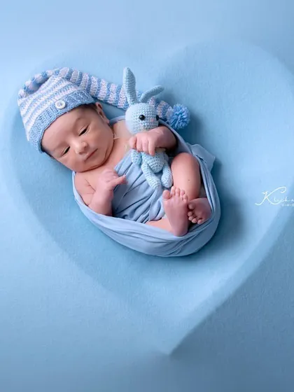 A heart full of blue. This digital composition places a sleeping baby in a soft blue heart, creating a dreamy and loving image perfect for a baby boy.
