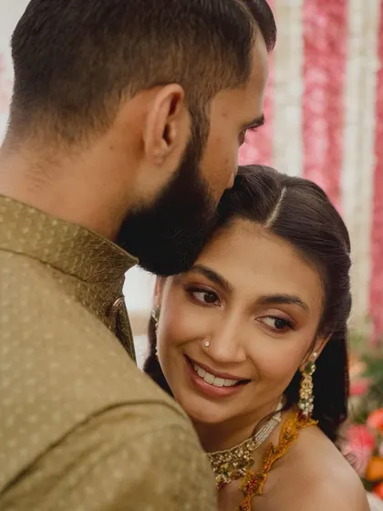 A tender moment between the childhood sweethearts on the first day of their wedding celebrations. Her makeup is soft and glowing.