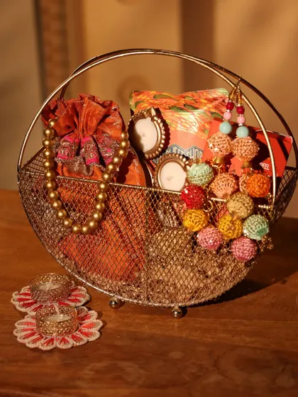 A different angle of the traditional wire basket hamper, showing the vibrant colors and textures of the curated items.