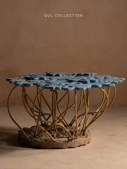 This is our Gul Table, inspired by a bouquet of flowers. The challenge was to capture the imperfect beauty of aging blooms, with each concrete petal uniquely positioned and supported by cast brass stems. It transforms any living space into a gallery of art.