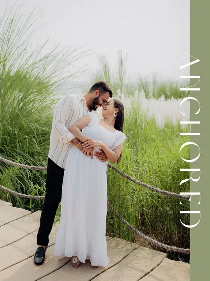 A beautifully composed portrait with an "Anchored" text overlay, symbolizing the couple's strong connection.