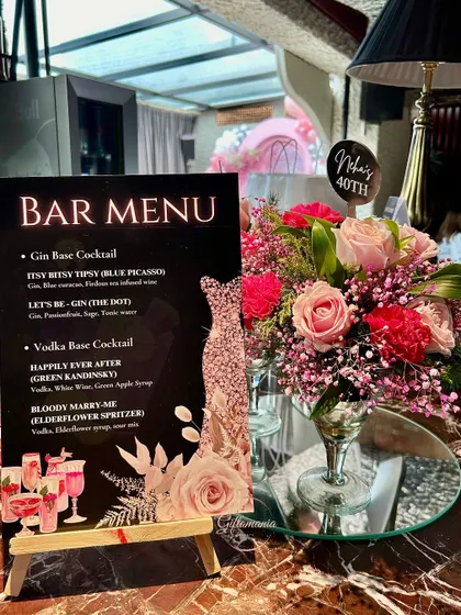 A personalized bar menu designed for a "Forty & Fabulous" themed birthday party. This detail shows how I coordinate every element, from custom event stationery and signage to the floral arrangements, ensuring a cohesive and high-end experience.