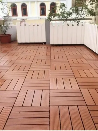 Our WPC deck tiles are easy to install and create a beautiful, warm wooden floor look on this terrace. They are durable, weather-resistant, and low-maintenance.
