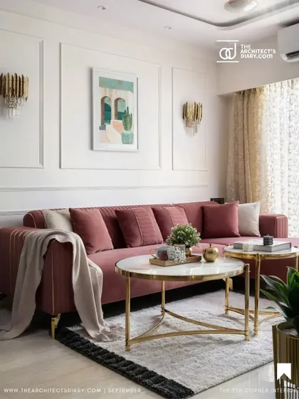 This feature highlights the custom pink L-shaped sofa and classic wall paneling, which create an elegant and welcoming ambiance in the living room.