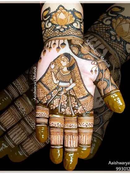 This design features a bride in a traditional pose, with a lotus cuff at the wrist, combining figure work with floral elements.