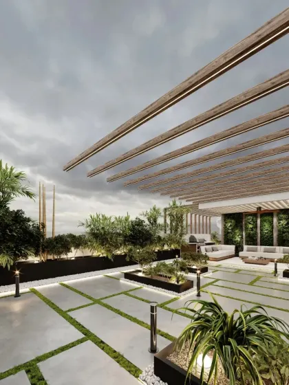 A wide-angle shot of the terrace, showcasing the expansive layout with modern planters and pathway lighting. The design is perfect for hosting larger gatherings.