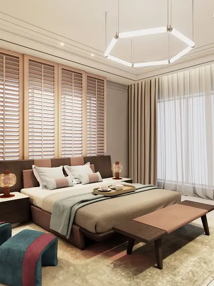 This daughter’s bedroom is a blend of warmth and elegance, with a custom bed in soft neutral tones of brown and pink. Pastel hues are elevated by a striking pop of color in the artistic lounge chair, adding a playful touch to the functional and stylish space.