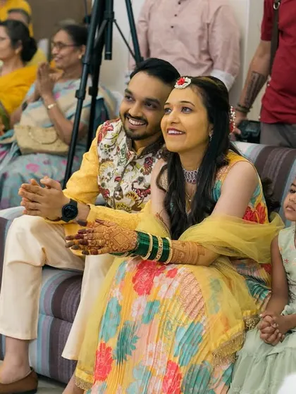 The couple enjoying the performances at their Sangeet ceremony.