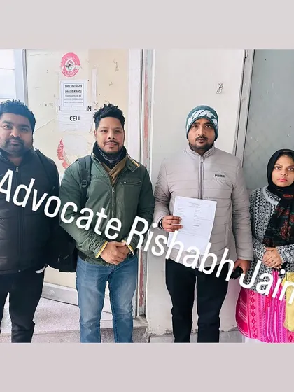 A couple stands with their family and me after completing their marriage registration in Delhi. I am here to provide any legal assistance you may need for your marriage.