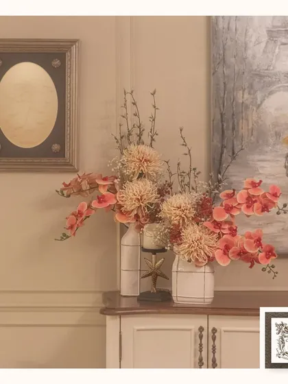This large painting of a romantic Paris scene, with a couple walking under an umbrella, contributes a touch of artistic charm and European flair to this beautiful decor ensemble.