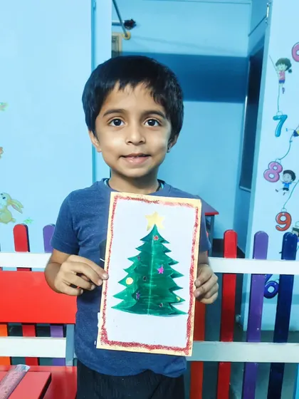 Another proud student with his handmade Christmas card. These make for wonderful gifts for family and friends.