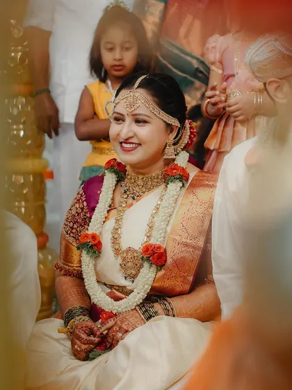 A radiant bride smiling during her wedding ceremony. These candid shots capture the genuine happiness of the moment.