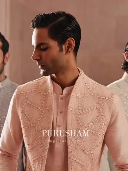 Draped in the gentle hues of elegance. This trio showcases different styles from my 'Takht' collection, with coordinated jackets in pastel pink and grey, perfect for the groom's closest friends.
