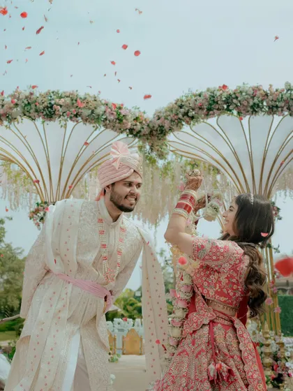 The playful and fun moment of the Varmala exchange, with the bride having the upper hand.