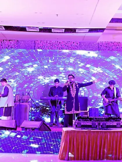 A live band performing at a Diwali party. The stage lights and energetic performance create a fantastic atmosphere, and I make sure to capture the entertainment that makes an event special.