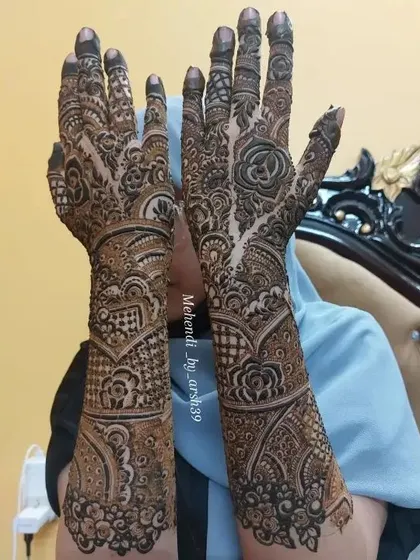 A full-length view of the bridal hands held up.